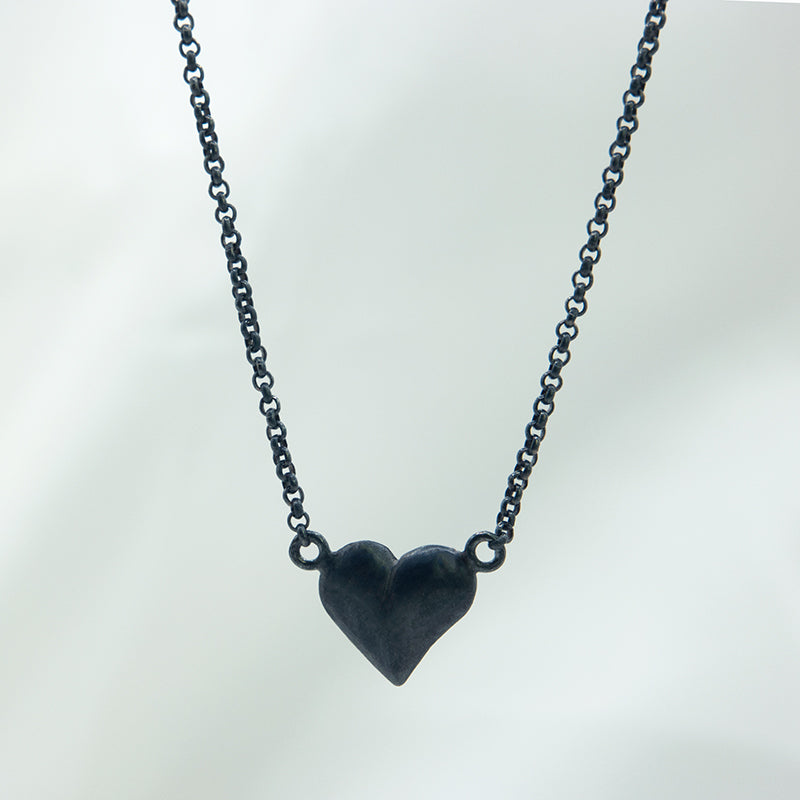 Zwart zilveren ketting met hartje